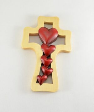 Kapky lásky –  světlý kříž s kaskádou červených srdcí